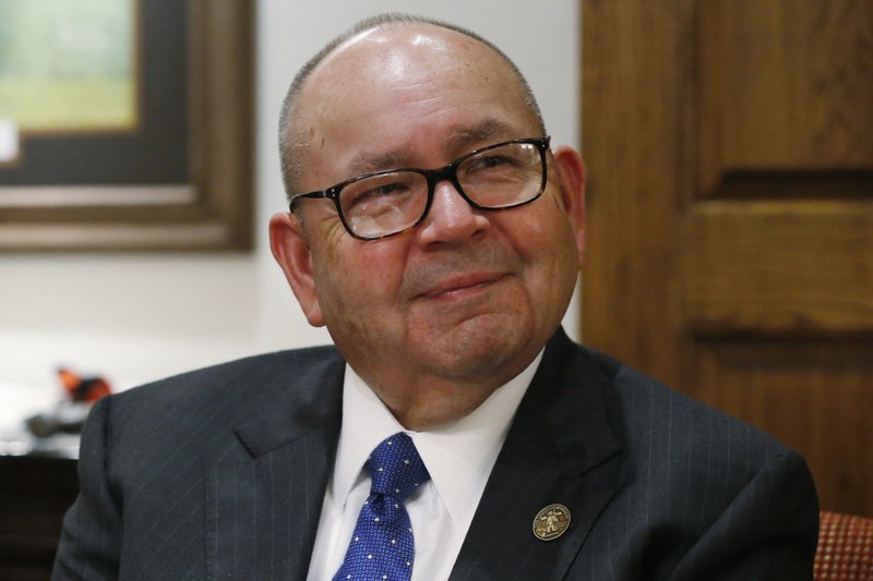 FILE - In this Sept. 17, 2019 file photo, Bill Anoatubby, Governor of the Chickasaw Nation, is pictured during an interview in his office in Ada, Okla. Three of the most powerful Indian tribes in Oklahoma are suing the governor over agreements that allow gambling at tribal casinos. The Cherokee, Chickasaw and Choctaw nations filed the complaint Tuesday, Dec. 31, 2019, in federal court in Oklahoma City. The tribes are asking a federal judge to decide whether the state's gaming compacts with the tribes expire on Jan. 1. (AP Photo/Sue Ogrocki File)