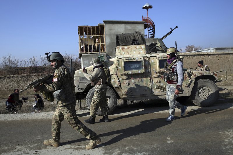 Security personnel arrive near the site of an attack near the Bagram Air Base In Parwan province of Kabul, Afghanistan, Wednesday, Dec. 11, 2019. A powerful suicide bombing Wednesday targeted an under-construction medical facility near the Bagram Air Base, the main American base north of the capital Kabul, the U.S. military said. 
(AP Photo/Rahmat Gul)