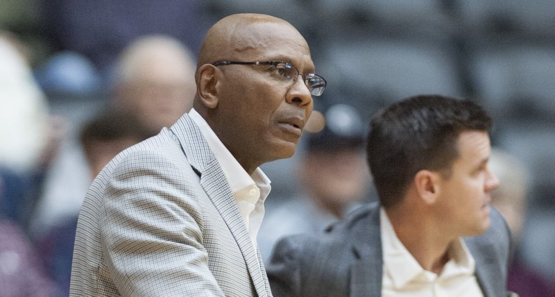 FILE — UALR coach Darrell Walker is shown at left.
