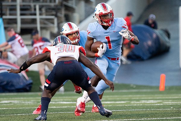 Little Rock Parkview running back James Jointer (1) tries to avoid a tackle by Marion linebacker Antonio Grays during a game Friday, Sept. 13, 2019, at War Memorial Stadium in Little Rock. 