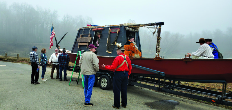 Photo by Bradly Gill

Ed Williams, in red, speaks to a Camden resident before the launch of the “Aux Arc” keel boat last Friday. Camden resident Emily Jordan Robertson can also be seen peaking out from the cabin. A crew of nine set out on the Ouachita River in the vessel.

