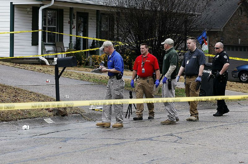 Sherwood police look for clues Friday morning at the scene of a double homicide on Markhaven Drive in Sherwood.
(Arkansas Democrat-Gazette/Thomas Metthe)