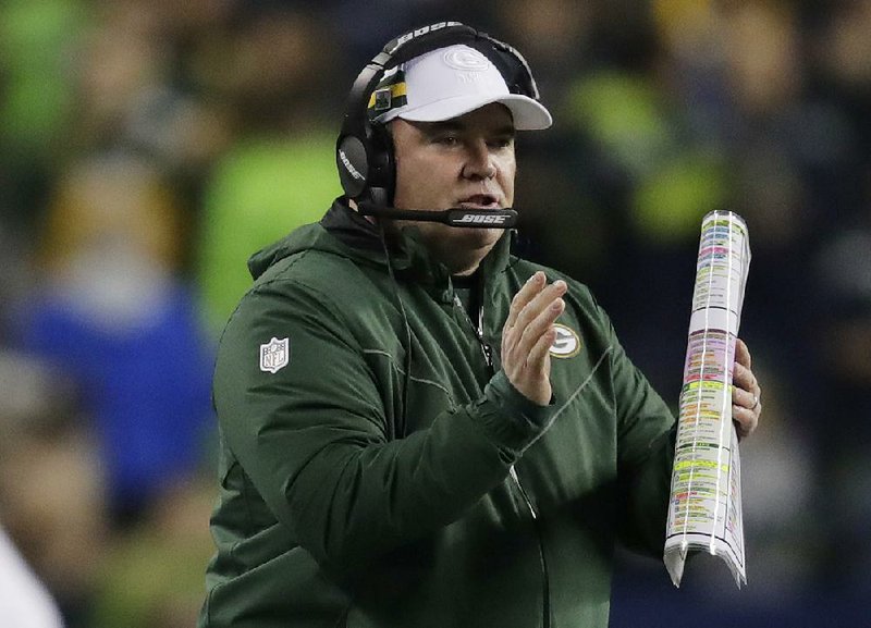 Green Bay Packers coach Mike McCarthy calls to his team during the first half of an NFL football game against the Seattle Seahawks, Thursday, Nov. 15, 2018, in Seattle. 
(AP Photo/Stephen Brashear)