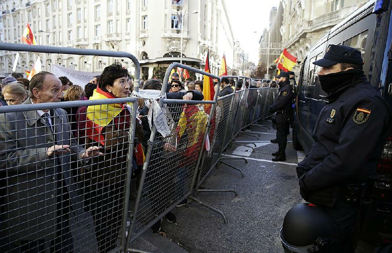 Demonstrators gather Saturday outside the Spanish parliamentary building in Madrid. More photos at arkansasonline.com/15spain/.
(AP/Andrea Comas)