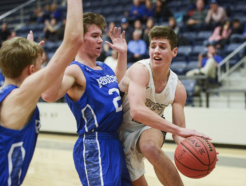 Bentonville West High School guard Dillon Bailey (right) looks to pass during a basketball game, Friday, January 11, 2019 at Wolverine Arena at Bentonville West in Centerton. 
(NWA Democrat-Gazette/CHARLIE KAIJO)

