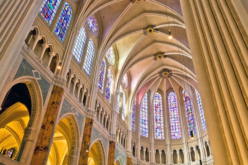 The pointed arches of Gothic cathedrals allow for dramatic stained-glass windows, such as the ones in Chartres' cathedral.
(Rick Steves' Europe/Dominic Arizona Bonuccelli)