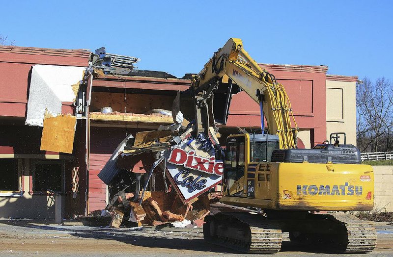 Demolition crews from PMI work Monday Jan. 6, 2020 tearing down the old Dixie Cafe location at 1301 Rebsamen Park Road in Little Rock. The site is the future location of Centennial Bank. (Arkansas Democrat-Gazette/Staton Breidenthal)  