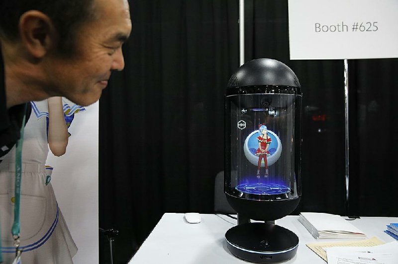 The Gatebox, a voice-powered home assistant with a virtual interactive character, is unveiled Sun- day ahead of today’s opening of the Consumer Electronics Show in Las Vegas. More photos at arkansasonline.com/17show/. 