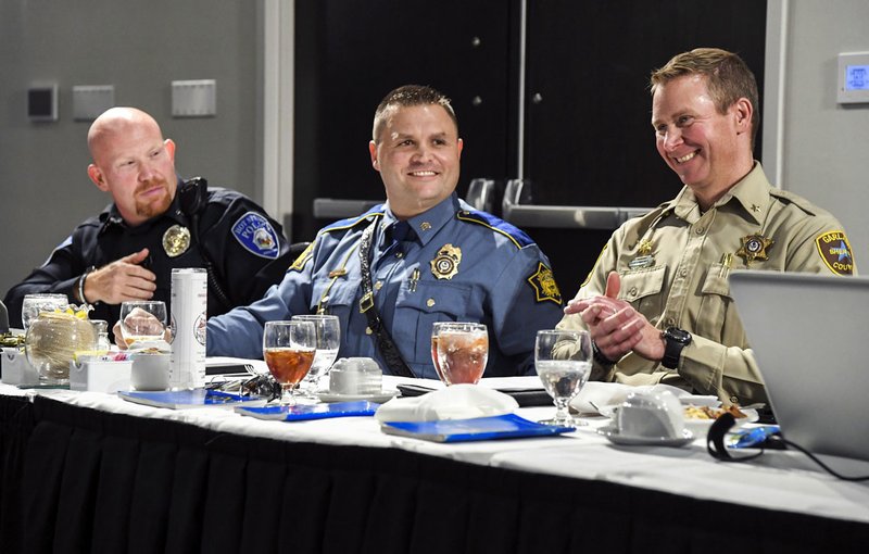 The Sentinel-Record/Grace Brown PANEL DISCUSSION: From left, Cpl. Joey Williams, public information officer with the Hot Springs Police Department, Sgt. Kevin Steed with Arkansas State Police Troop K, and Garland County Under Sheriff Jason Lawrence sit on a panel for Law Enforcement Appreciation Day at Monday's Oaklawn Rotary Club meeting at The Hotel Hot Springs &amp; Spa.