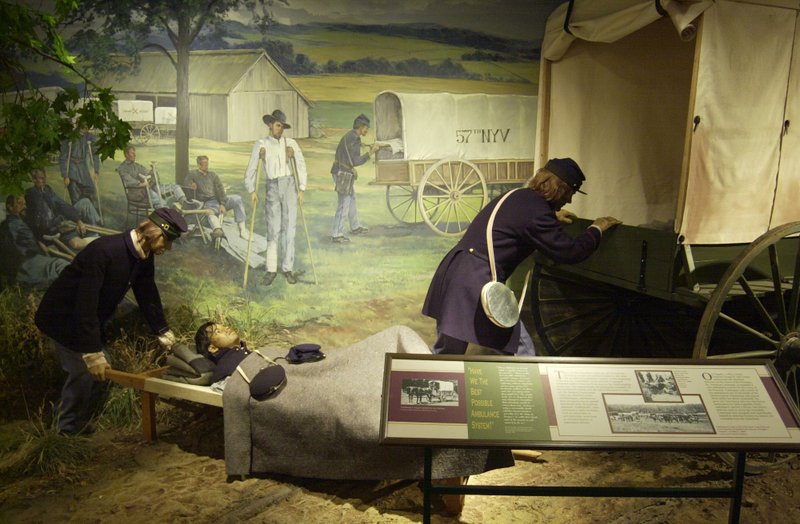 An exhibit showing what ambulance service would have been like during the Civil War as surgeons transport a wounded soldier into a wagon. This and other exhibits are on display at the National Museum of Civil War Medicine in Frederick, Md. MUST CREDIT: Washington Post photo by Ricky Carioti