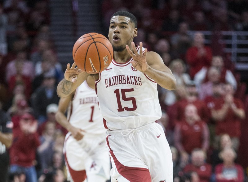 Mason Jones, Arkansas guard, passes the ball in the first half vs Texas A&M Saturday, Jan. 4, 2020, at Bud Walton Arena in Fayetteville. The Razorback guard leads the team in scoring (17.9), rebounding (6.2), assists (33) and steals (23).