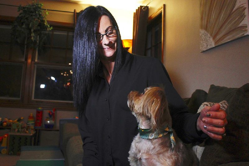Amy Carter of St. Francis, Wis., says CBD oil has greatly reduced her epileptic dog’s seizures. “It’s amazing” she said. “Bentley was having multiple seizures a week. To have only six in the past seven months is absolutely incredible.” More photos at arkansasonline.com/18cbd/.
(AP/Carrie Antlfinger)