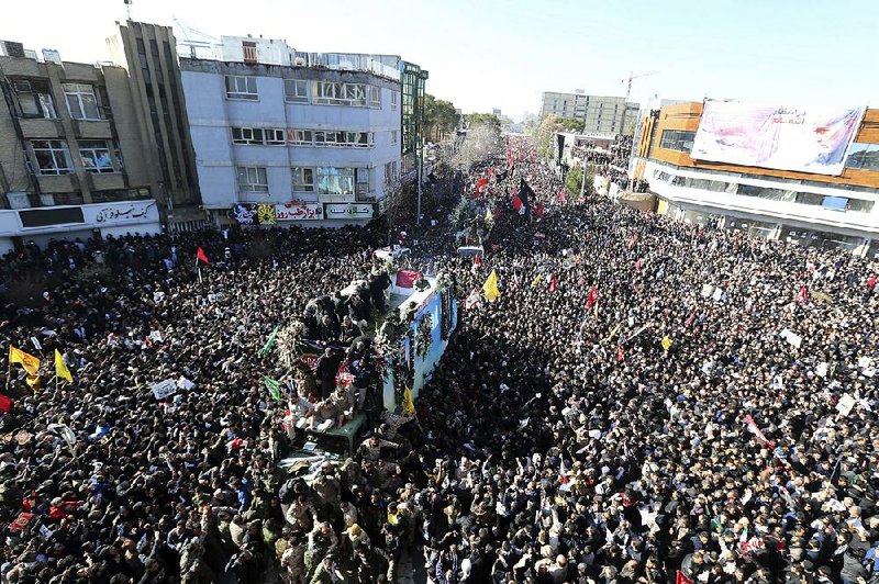 Thousands of mourners surround the funeral train of Gen. Qassem Soleimani and others Tuesday in the Iranian city of Kerman, Soleimani’s hometown.
(AP)