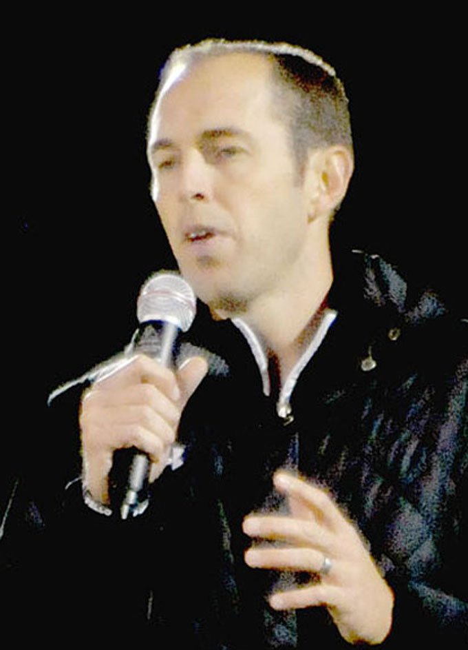 MARK HUMPHREY ENTERPRISE-LEADER/Former Razorback Jeb Huckeba, who went on to play pro football for the NFL's Seattle Seahawks, speaks during an Oct. 10, 2018 Fellowship of Christian Athletes &quot;Fields of Faith&quot; event at Farmington's Allen Holland Field. A year later, Jeb's father, retired Harding University head football coach Ronnie Huckeba, came to Farmington to speak at another FCA event.