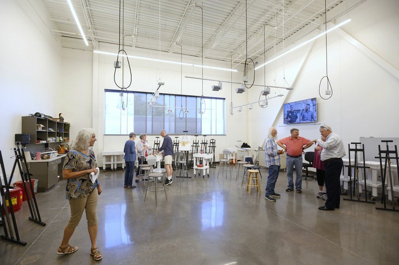 NWA Democrat-Gazette/Spencer Tirey Visitors toured Northwest Arkansas Community College's Integrated Design Lab building on its Bentonville campus. The building hosts courses in construction, fine arts, and computer-aided drafting.