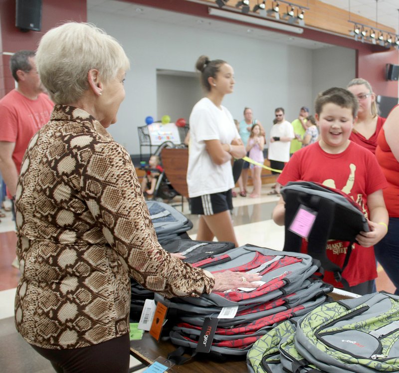 FILE PHOTO The 2019 Lincoln Back to School Bonanza served 212 children from 99 families. Children went home with new shoes, socks, backpacks, school supplies and a new haircut.