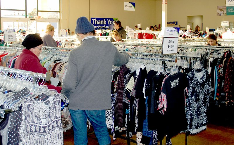 Marc Hayot/Herald Leader Customers shop eagerly on Dec. 20, the day of the store's grand reopening.