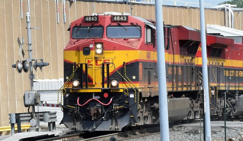 Westside Eagle Observer/MIKE ECKELS A southbound Kansas City Southern grain train passes through the Roller Ave. crossing on its way to parts unknown Aug. 20, 2019. According to KCS, 12-15 trains cross over this intersection on a daily basis.