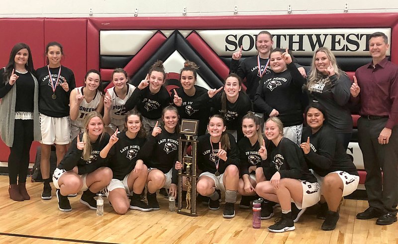 SUBMITTED The Gentry Lady Pioneers, with assitant coach Courtney Milsap (left) and head coach Toby Tevebaugh (right), show off their trophy after sweeping the Southwest Tournament in Missouri over the Christmas break.