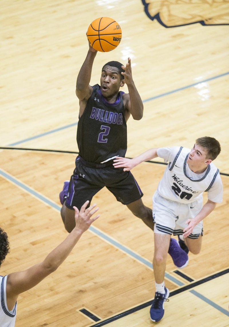 NWA Democrat-Gazette/BEN GOFF @NWABENGOFF Isaiah Raleford, Fayetteville point guard, passes the ball vs Bentonville West center, defends Tuesday, Jan. 7, 2020, at Wolverine Arena in Centerton. Go to http://bit.ly/2ZZflpb to see more photos from the game.
