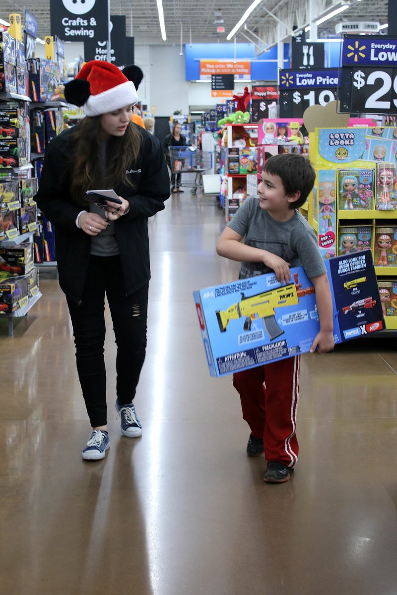 MEGAN DAVIS/MCDONALD COUNTY PRESS Cadets from Crowder College's Criminal Justice Program were also in attendance to assist children with selecting and budgeting gifts.