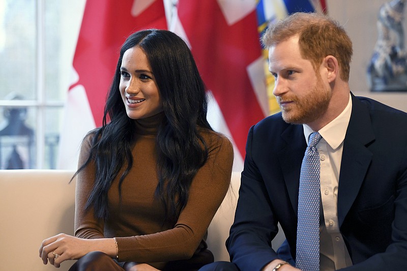 FILE - In this Tuesday, Jan. 7, 2020 file photo, Britain's Prince Harry and Meghan, Duchess of Sussex smile during their visit to Canada House, in London.(Daniel Leal-Olivas/Pool Photo via AP, file)