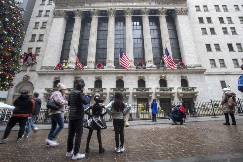 In this Jan. 3, 2020, file photo visitors to the New York Stock Exchange pause to take photos in New York. 
(AP Photo/Mary Altaffer, File)