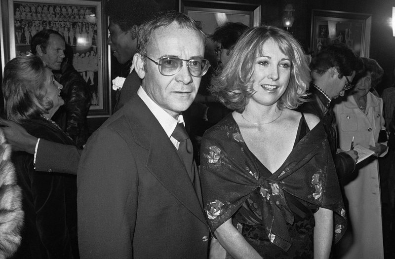 FILE - In this Nov. 15, 1977, file photo, Buck Henry and Teri Garr appear at the opening of the movie &quot;Close Encounters of the Third Kind&quot; in New York. Henry, the versatile writer, director and character actor who co-wrote and appeared in &quot;The Graduate'' has died in Los Angeles. He was 89. Henry's wife, Irene Ramp, told The Washington Post that his death was due to a heart attack. (AP Photo/Ira Schwarz, File)