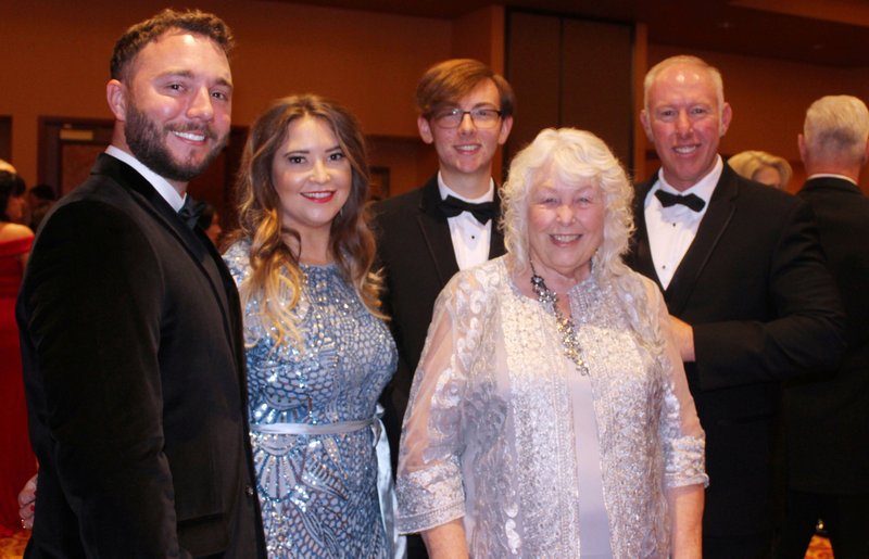 Karen Inlow (second from right) is joined by her family Adam and Shelby Reynolds (from left), Lee Inlow and Jeff Inlow. The Charles and Karen Inlow family were honored as the Outstanding Philanthropic Family by the foundation. (NWA Democrat-Gazette/Carin Schoppmeyer)