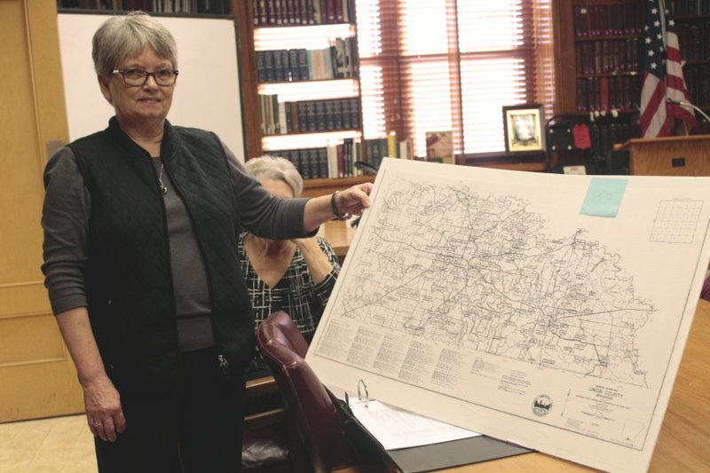 Union County Genealogical Society President Carolyn Smith shows one of the cemetary maps produced by members of the club. The maps are available for sale at $5.