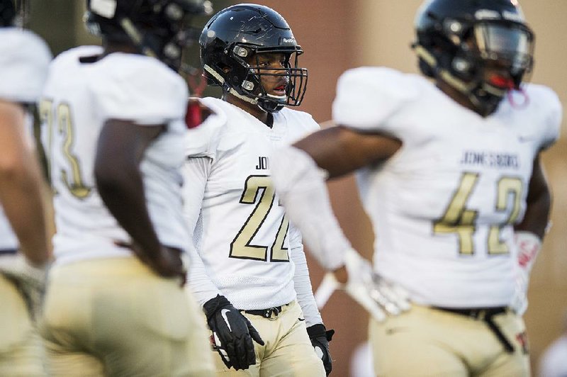 Jonesboro senior defensive lineman Jashaud Stewart (center) recorded a state-high 17 sacks in 2019, leading the Hurricane to the Class 6A playoffs. Stewart signed with the University of Arkansas in December.