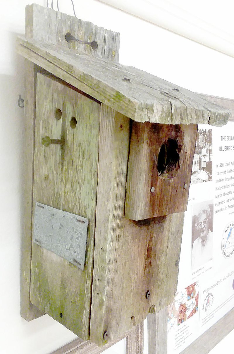 NWA Democrat-Gazette/ KEITH BRYANT A bluebird house used for roughly 20 years is now retired and on display at the Bella Vista Historical Museum as part of an exhibit highlighting the Bella Vista Bluebird Society, one of the community's volunteer groups that have set up bluebird houses across the golf courses. Anyone interested in joining the Bluebird Society can find out more at bvbluebirds.com.