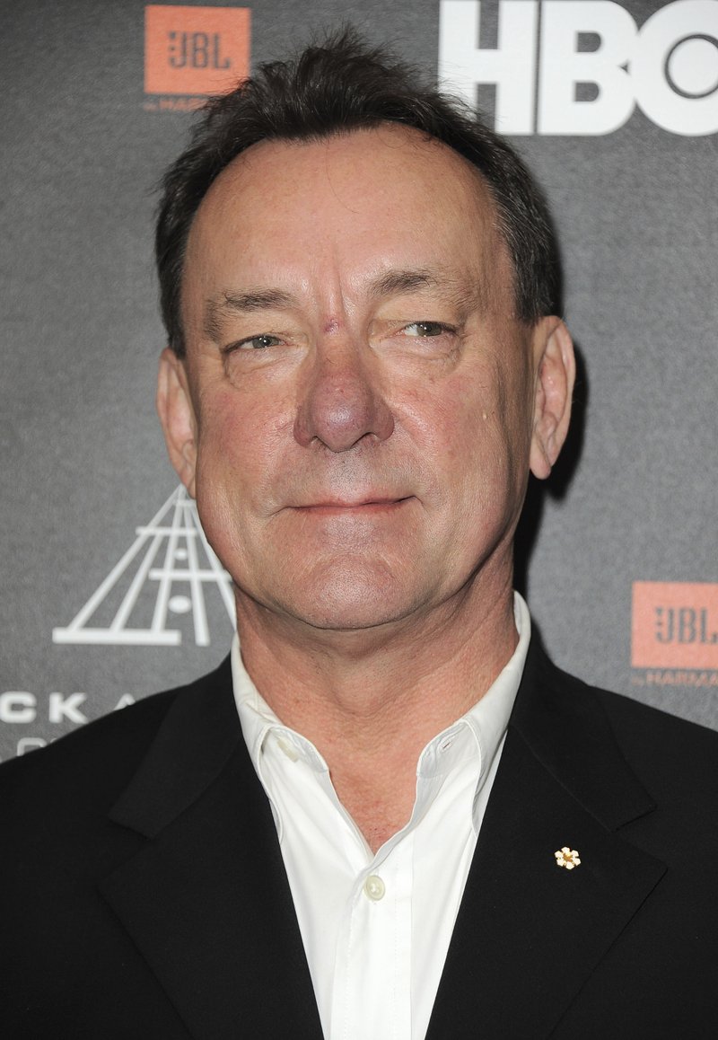 FILE - This April 18, 2013 file photo shows Neil Peart at the Rock and Roll Hall of Fame Induction Ceremony in Los Angeles. Peart, the renowned drummer and lyricist from the band Rush, has died. His rep Elliot Mintz said in a statement Friday that he died at his home Tuesday, Jan. 7, 2020 in Santa Monica, Calif. He was 67. (Photo by Jordan Strauss/Invision, File)