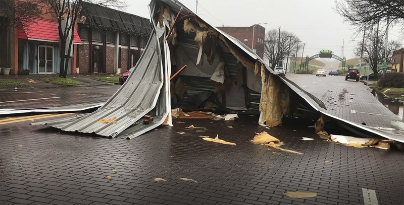 In this image taken from video, severe storms sweeping across parts of the U.S. South were blamed for deaths and destruction on Saturday, including the damages to a number of downtown Greenville, Miss., businesses. High winds, tornadoes and unrelenting rain battered a large area of the South. -Faith Alford/WABG via AP