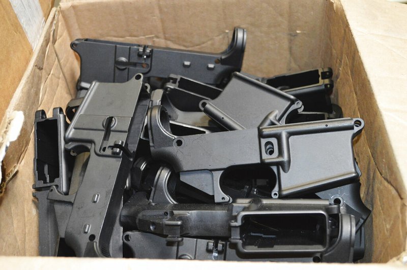 This photo provided by the U.S. Department of Justice shows AR-15 lower receivers, which federal agents have seized, including these unfinished ones taken in 2014 in California, for firearms investigations nationwide. For decades, the federal government has treated the mechanism called the lower receiver as the essential piece of the semiautomatic rifle, which has been used in some of the nation's deadliest mass shootings. But some defense attorneys have recently argued that the part alone does not meet the definition in the law. (U.S. Department of Justice via AP) story.lead_photo.caption