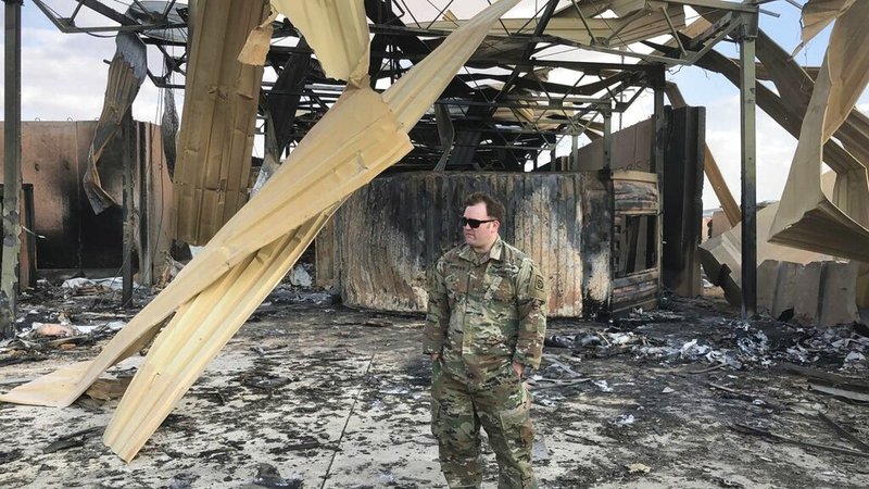 A U.S. soldier stands at a site of Iranian bombing, in Ain al-Asad air base, Anbar, Iraq, Monday, Jan. 13, 2020.