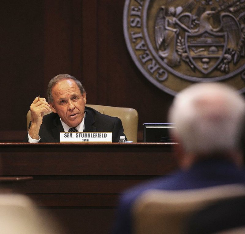 Sen. Gary Stubblefield questions Gov. Asa Hutchinson on Monday at the state Capitol during a committee meeting about the governor’s decision that Arkansas will continue to accept refugees.