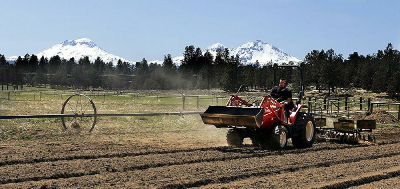 Trevor Eubanks, plant manager for Big Top Farms, readies a field for a hemp crop near Sisters, Ore. The U.S. Department of Agriculture estimates that 20% of hemp lots would fail to meet the standards under the proposed federal regulations. More photos at arkansasonline.com/114hemp/.  