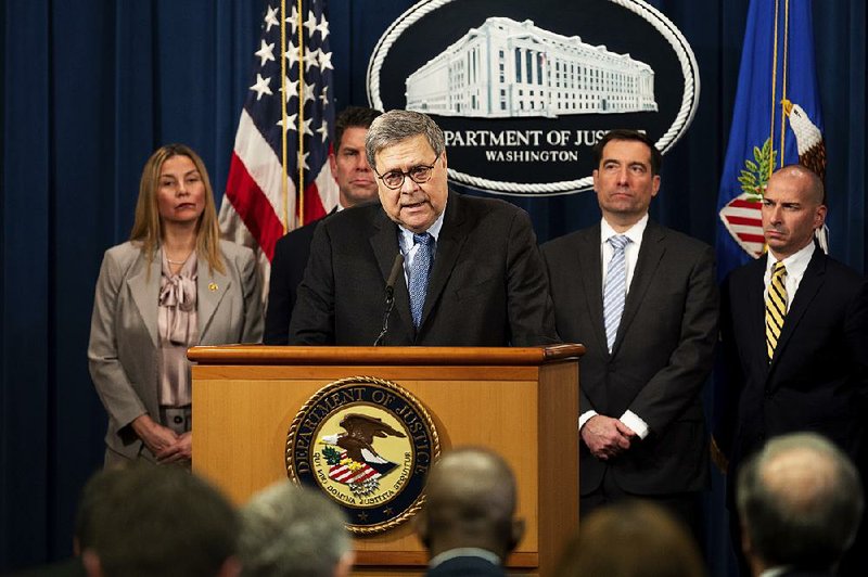 Attorney General William Barr says Monday that the Justice Department concluded the expelled trainees’ conduct did not meet the standards for federal prosecution. More photos at arkansasonline.com/114shooting/.