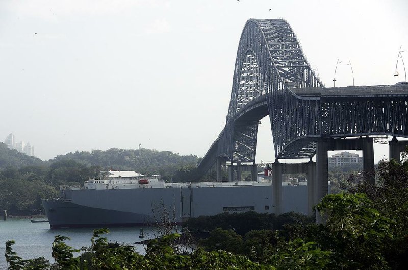 A cargo ship on the Panama Canal nears the Pacific Ocean on Monday as it passes Panama City.