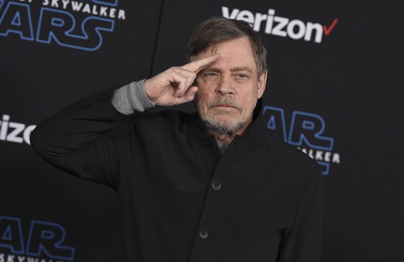 File - In this Dec. 16, 2019, file photo, Mark Hamill arrives at the world premiere of &quot;Star Wars: The Rise of Skywalker&quot; in Los Angeles. The force was strong enough at an Arizona store to reunite Luke Skywalker with his long-lost vinyl record. Hamill is praising workers at Bookmans Entertainment Exchange in Flagstaff for returning the &quot;Star Wars: A New Hope&quot; soundtrack that had been a gift from film composer John Williams. Hamill said in a tweet Saturday, Jan. 11, 2020, that it felt &quot;totally unexpected &amp; positively surreal&quot; to get back the record he had not seen since the early 1990s. He commended the store about 145 miles (233 kilometers) north of Phoenix for being honest and not selling it. (Jordan Strauss/Invision/AP, File)