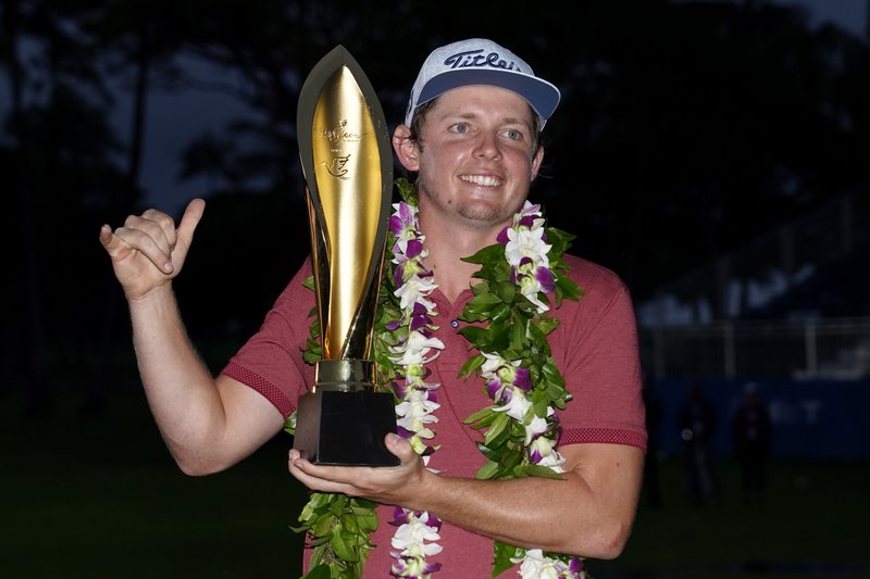 Cameron Smith holds the champions trophy after the final round of the Sony Open Sunday at Waialae Country Club in Honolulu. - Photo by Matt York of The Associated Press story.lead_photo.caption