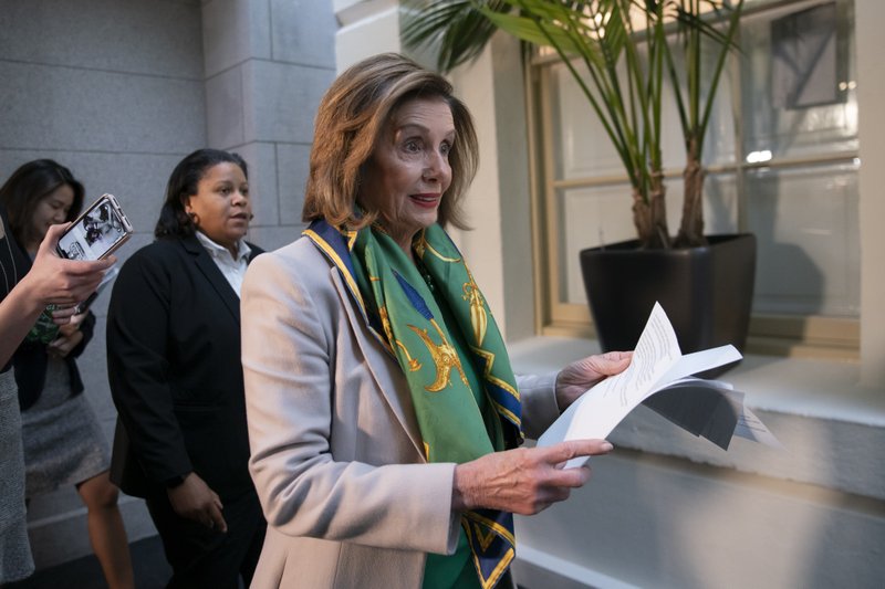 Speaker of the House Nancy Pelosi, D-Calif., arrives to meet with the Democratic Caucus at the Capitol in Washington, Tuesday, Jan. 14, 2020. Pelosi, who has not yet relayed the articles of impeachment to the Senate for the trial of President Donald Trump, has said she will discuss her next steps in that delayed process during her meeting today with fellow Democrats. Trump was impeached by the Democratic-led House last month on charges of abuse of power over pushing Ukraine to investigate Democratic rival Joe Biden and obstruction of Congress in the probe. (AP Photo/J. Scott Applewhite)

