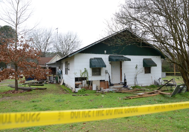 Crime scene tape wraps the property at 310 Calvin Street in Stamps after a Sunday night homicide at the address.  