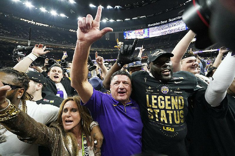 LSU Coach Ed Orgeron celebrates with players after the Tigers defeated Clemson to win the national championship Monday night. Orgeron will have to replace several key players to contend for the title next season.
(AP/David J. Phillip)