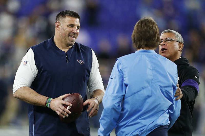 Tennessee Coach Mike Vrabel (left) has been pushing the Titans to find ways to improve after three consecutive 9-7 seasons. Now he has them in the AFC Championship Game for the first time since the 2002 season.
(AP/Julio Cortez)