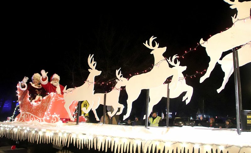 FILE PHOTO The second annual Christmas Parade of Lights attracted many entries and lots of spectators. Santa Claus and Mrs. Claus are preparing for Christmas Eve.