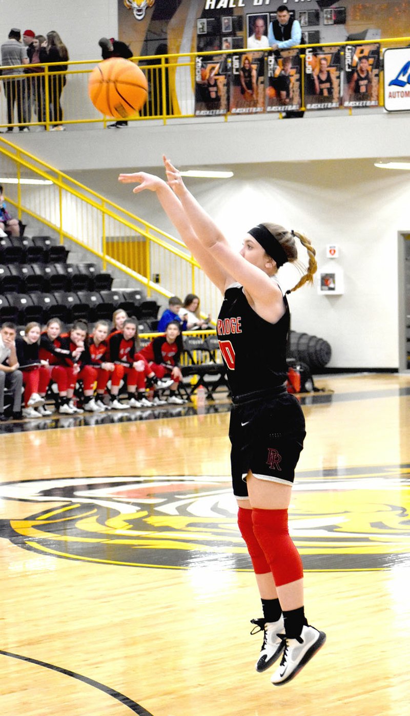 ENTERPRISE-LEADER photograph by Mark Humphrey Lady Blackhawk junior Ravin Cawthon hit a 3-pointer to give the Pea Ridge girls an early 6-2 lead during a 48-26 win at Tiger Arena in a rescheduled game played Monday, Jan. 13.