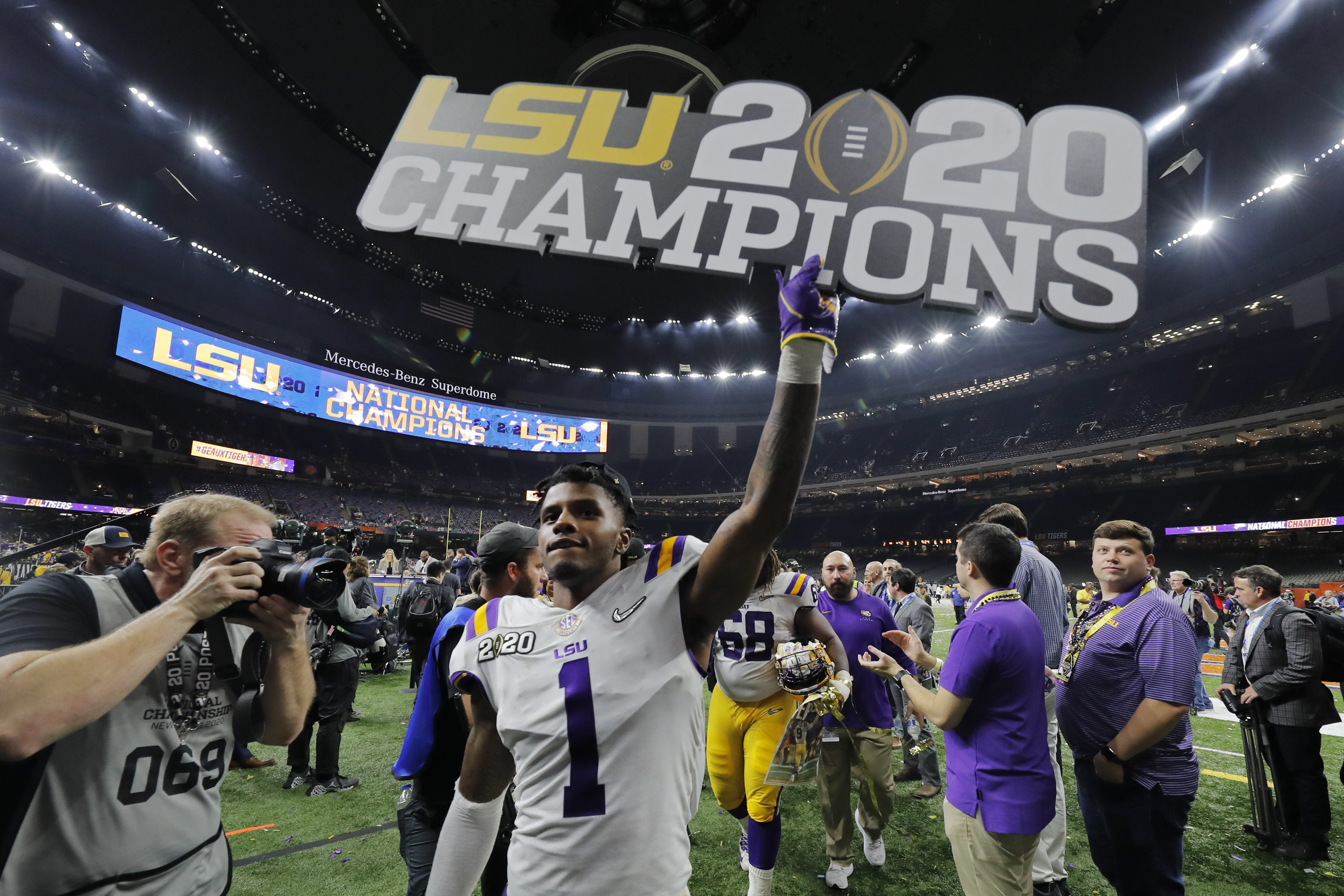 LSU's quarterback Joe Burrow runs for 29 yards to set up a touchdown in  second quarter of the college national championship game against Clemson at  the Superdome in New Orleans, Louisiana on