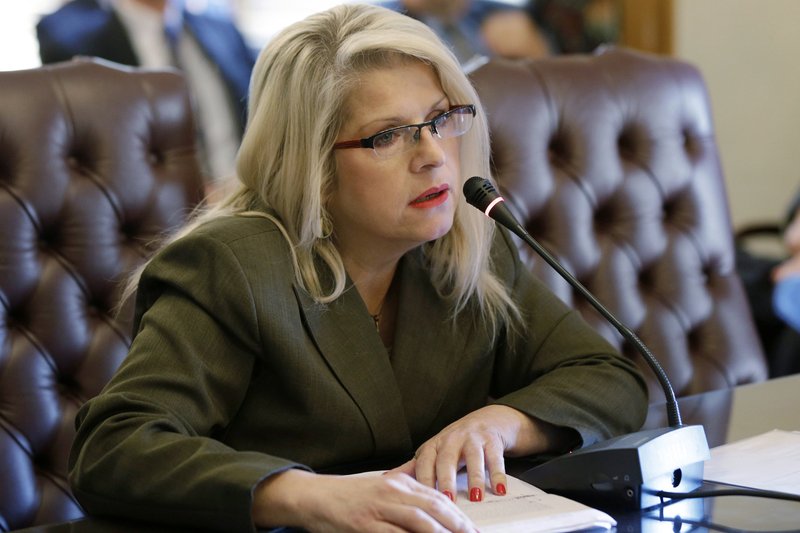 FILE - In this Jan. 28, 2015, file photo, Sen. Linda Collins-Smith, R-Pocahontas, speaks at the Arkansas state Capitol in Little Rock, Ark. A woman charged with killing the former Arkansas state lawmaker faces new charges alleging that she asked fellow inmates to kill the victim's ex-husband. Authorities on Tuesday, Jan. 14, 2019, charged Rebecca Lynn O'Donnell with two counts of criminal solicitation to commit capital murder and two counts of criminal solicitation to commit tampering with physical evidence. (AP Photo/Danny Johnston, File)